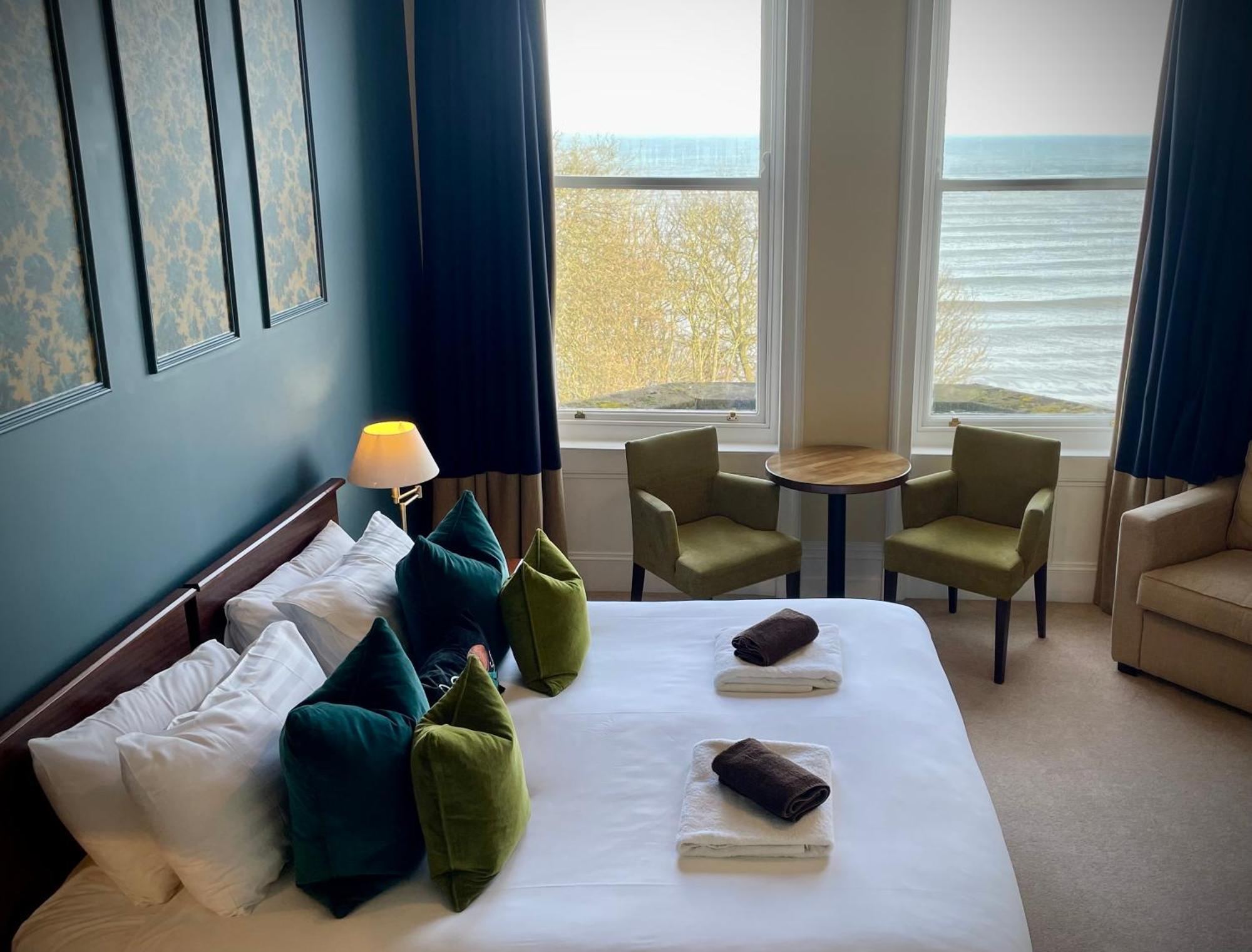 Seaview Double Room with sitting chairs at The Weston Hotel
